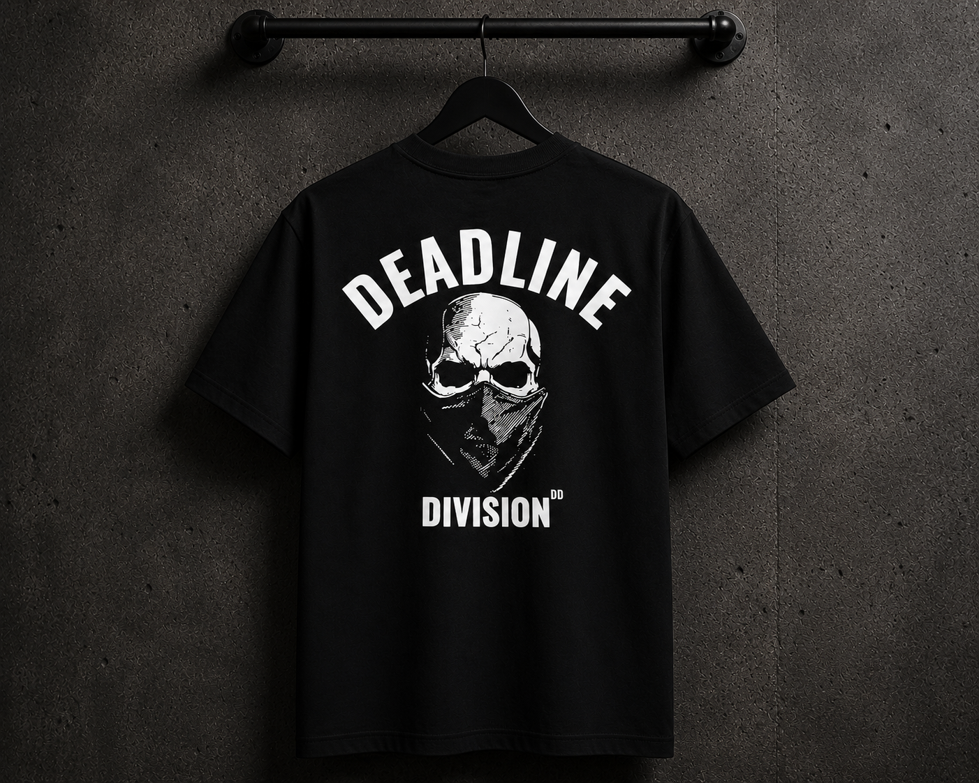 Black t-shirt with 'Deadline Division' graphic on a hanger against a dark background