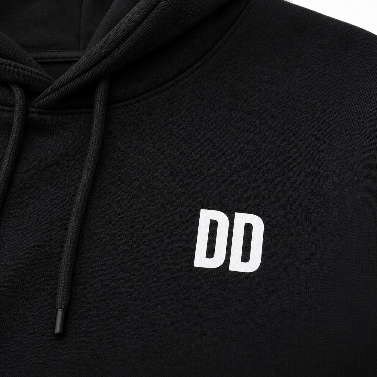 Black hoodie with white 'DD' logo on a white background